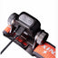 Close-up of a headlamp with orange strap and control buttons on a white background