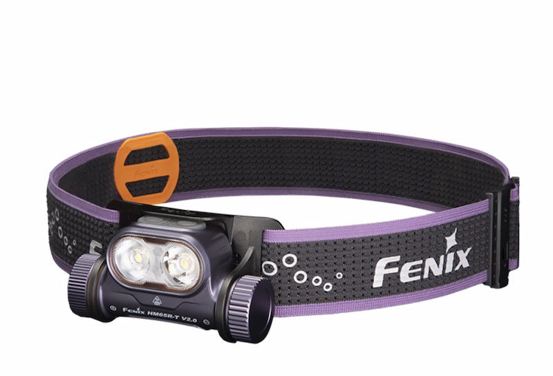 Fenix headlamp with purple band on a white background