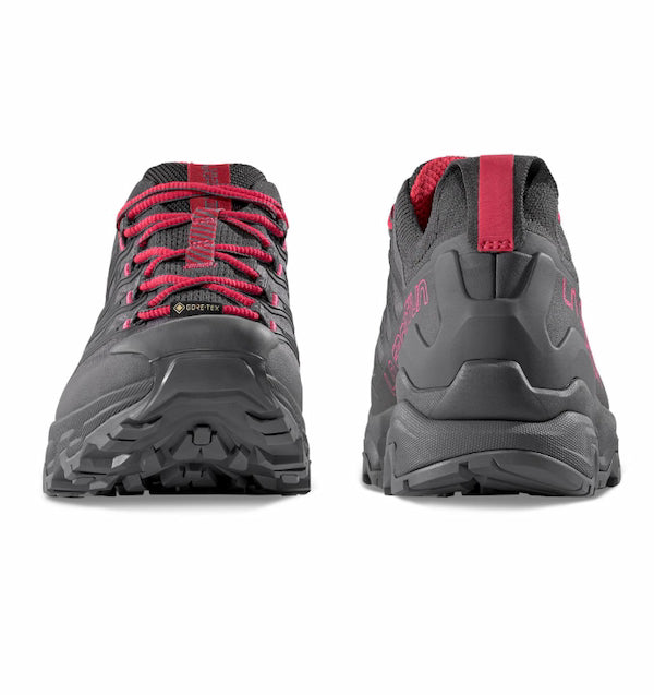 Pair of gray and red hiking shoes on a white background