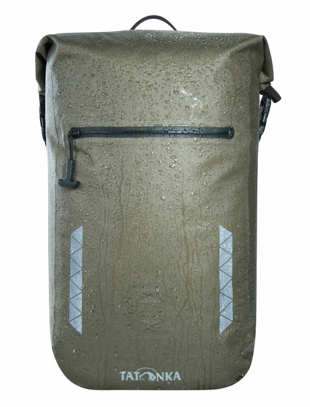 Green backpack with reflective stripes and Tatonka branding on a white background