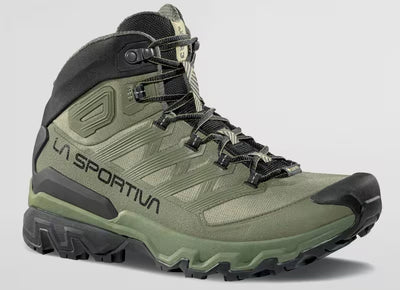 Green hiking boot with black accents on a white background