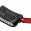 Close-up of the back of a black smart headlamp with a red and black braided cord on a white background.