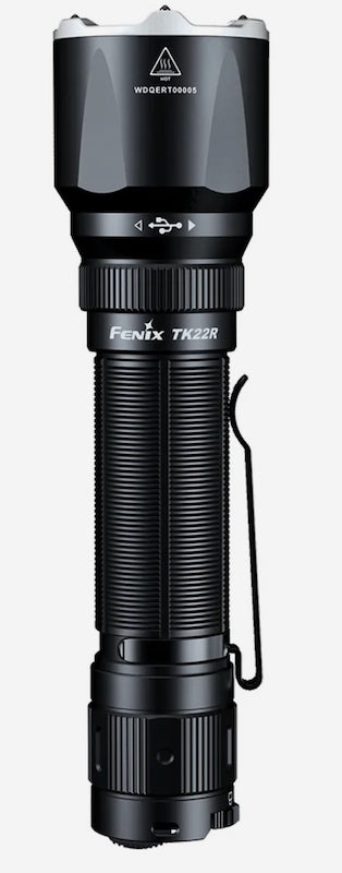 A Fenix TK22R flashlight in matte black with a textured grip, a side clip, and a silver top cap, shown against a plain light gray background.