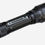 A black tactical flashlight with a textured grip and a ridged bezel, shown at an angle on a light gray background.
