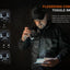 A man in a black tactical jacket and cap demonstrates the Flexisensa Control Toggle Switch on a flashlight, with three mode icons (Tactical, Duty, Lockout) and product text on a dark background.