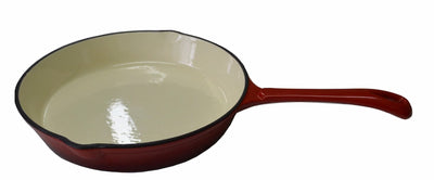 A red enameled cast iron skillet with a cream-colored interior, shown from a side angle on a white background.