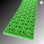 Green textured mat with circular patterns on a gradient background