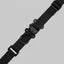 Black tactical strap on a light gray background