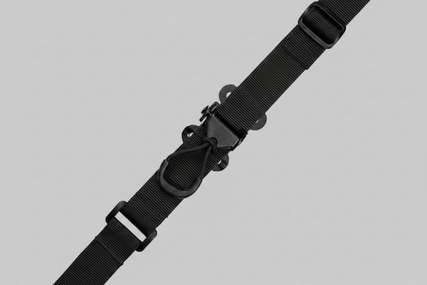 Black tactical strap on a light gray background