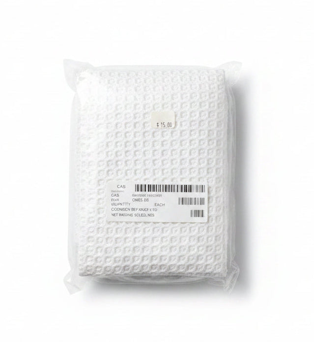 A white textured pillowcase folded and sealed in a clear plastic bag, with a white shipping label and barcode on a plain white background.