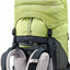 A close-up of a hiking backpack showing the top compartment, compression straps, and padded mesh back support in lime green, black, and gray.