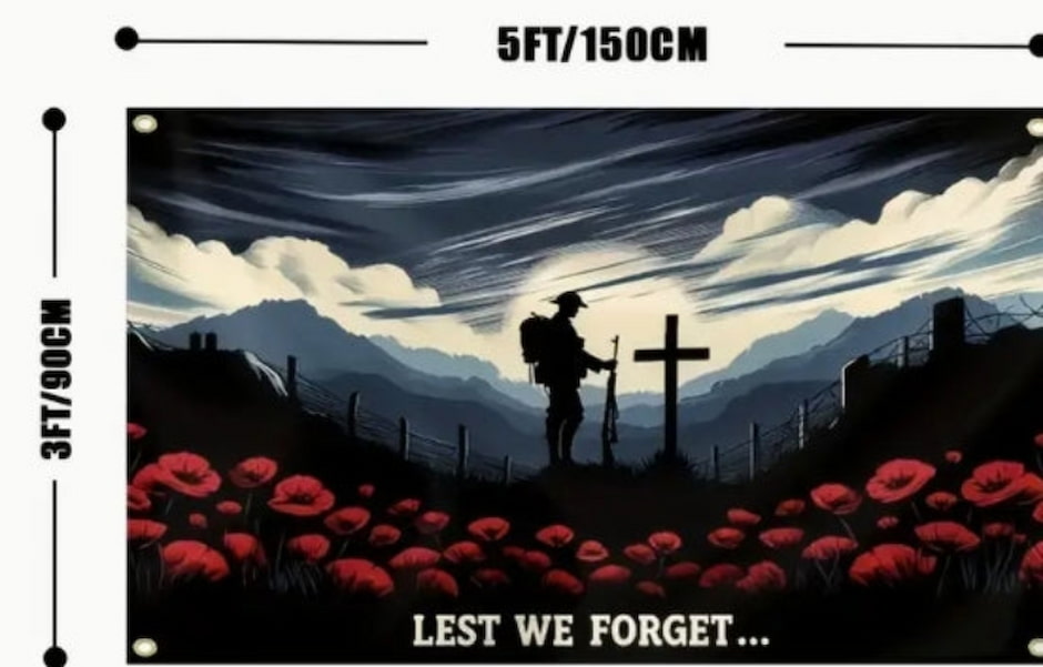 Silhouette of a soldier with a rifle at a cross in a field of red poppies with 'Lest We Forget' text, set against a mountainous landscape.
