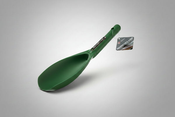 Green scoop with a brand label on a gray background