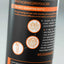 Close-up of a dark bottle label with orange text and recycling icons, including the Granger's brand message about next generation bottles and recycled plastic.