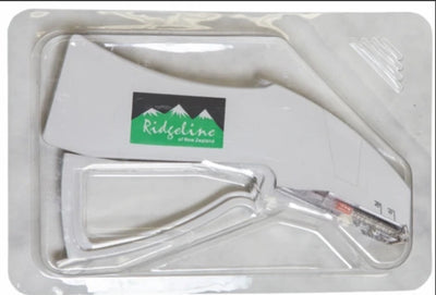A clear plastic buttstock with a white plastic sling and a green and black Ridgeline of New Zealand logo, packaged in a clear blister pack.