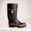 Black rubber boot with red trim on a light beige background