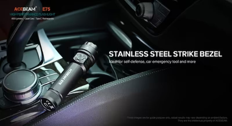 Acebeam E75 flashlight with stainless steel strike bezel on car dashboard