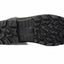 A close-up, top-down view of a black rubber boot sole with deep, aggressive tread patterns, shown against a plain white background.