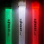 Three glow sticks in green, white, and red with 'Kombat UK' branding on a dark textured background.