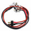 Electrical wiring kit with red and black cables on a white background
