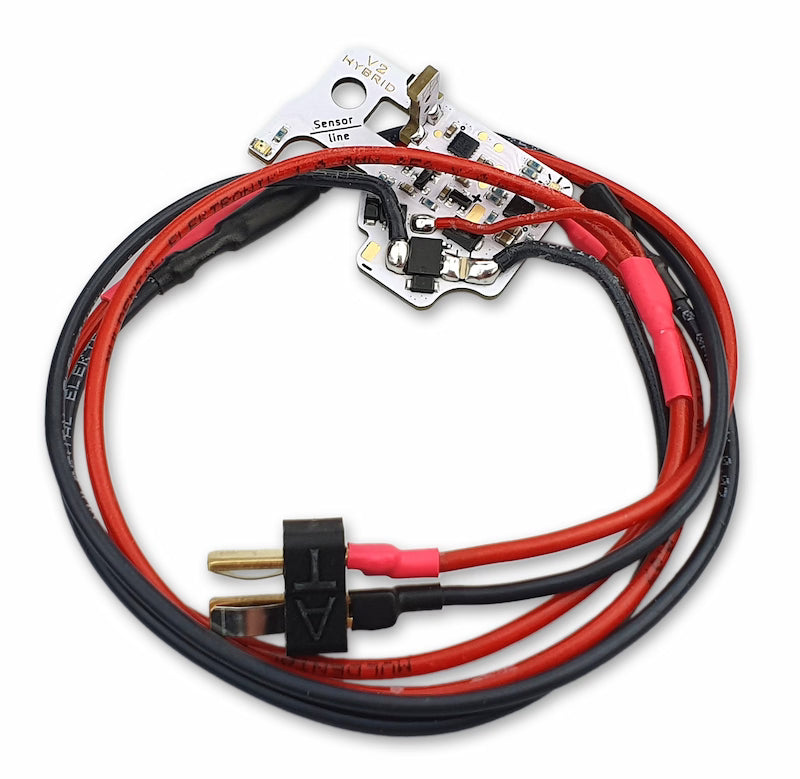 Electrical wiring kit with red and black cables on a white background