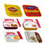 Collection of various food products including Vegemite, Marmite, Craig's strawberry fruit jam, honey, margarine, and Rospa peanut butter on a white background.