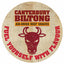 Round Canterbury Biltong logo with a bull illustration and text on a wooden background