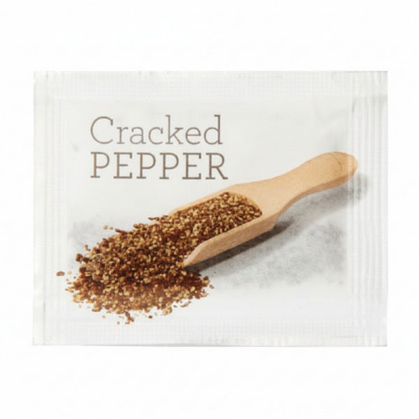 Packaged cracked pepper with a wooden scoop on a white background