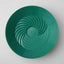 Green plastic lid with a textured surface on a white background