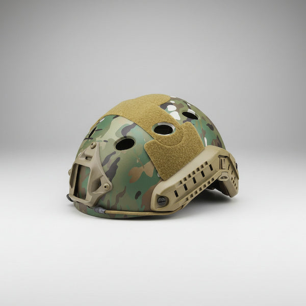 Camouflage helmet with tan accents on a gray background