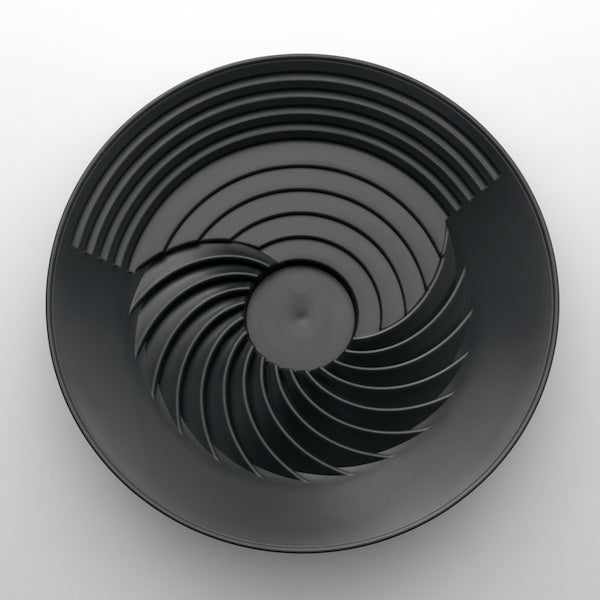 Black circular object with concentric rings on a white background