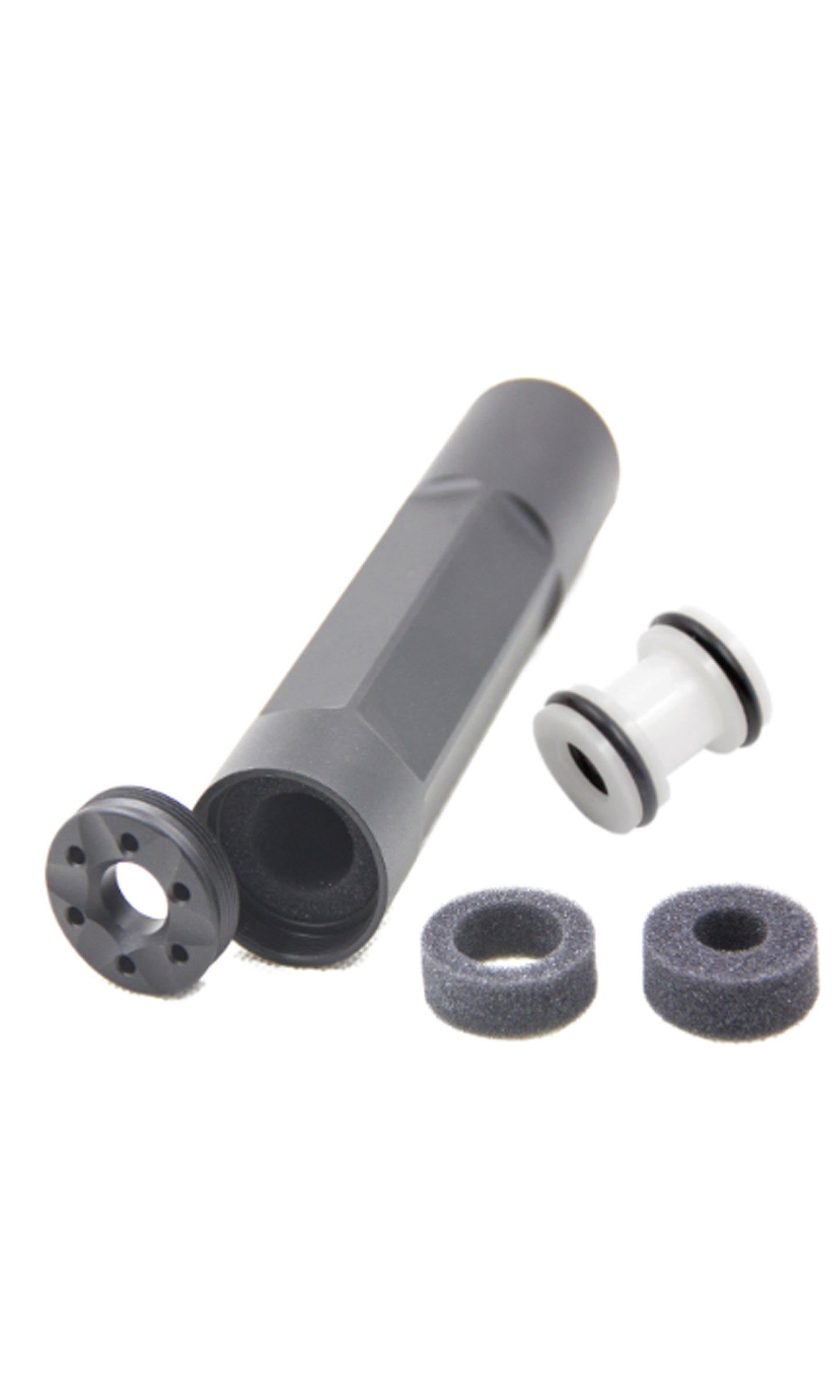 An airsoft suppressor with barrel spacer and additional parts, primarily in black color.