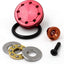 An image of an aluminium piston head for airsoft guns, displayed alongside its components such as seals and a washer. The piston head has a red metallic finish.